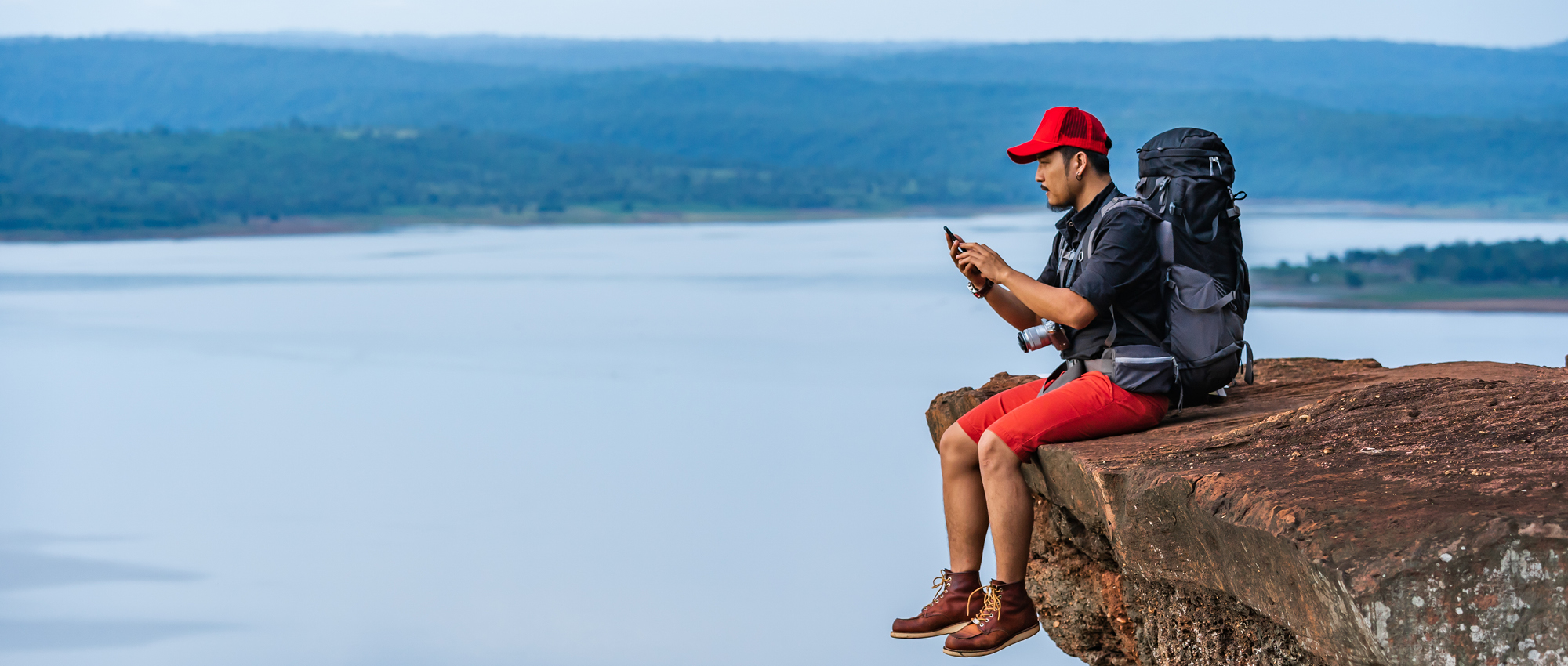 man sitting on a rock