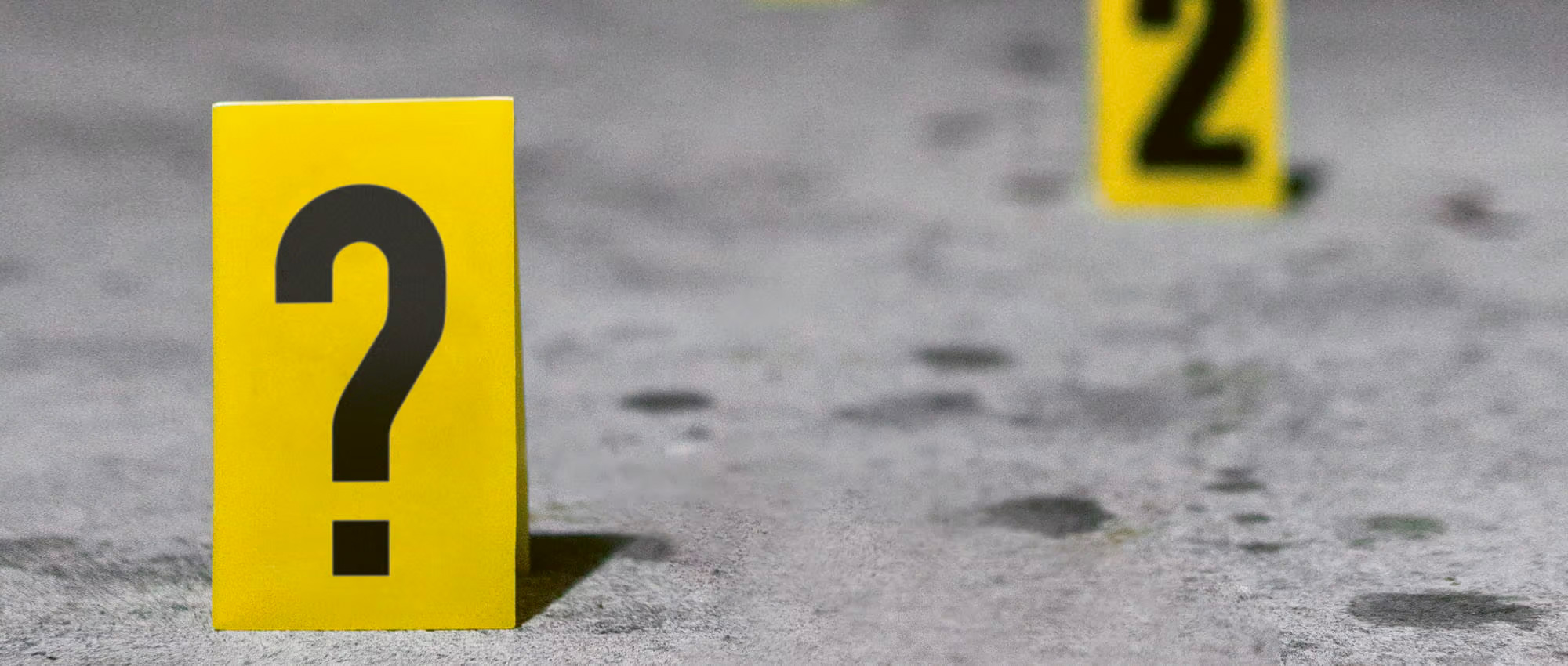 Yellow evidence cards on the ground