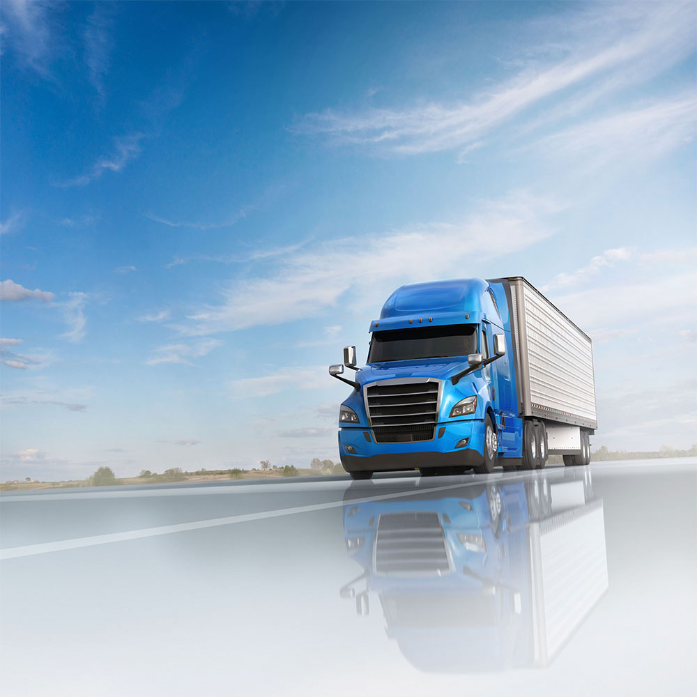 High-gloss image of a blue truck with a trailer driving on an open highway under a bright blue sky