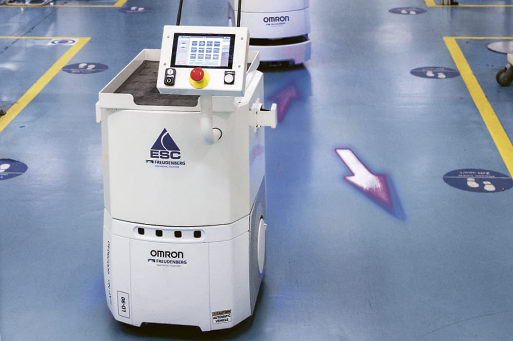 Two AMR robots drive through the North Shields plant